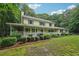 Charming two-story home with a welcoming front porch and lush green landscaping at 2110 Waterloo Cir, Lawrenceville, GA 30043