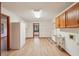 Well-lit laundry room featuring a utility sink and ample shelving at 2110 Waterloo Cir, Lawrenceville, GA 30043