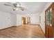 Bright living room boasts wood floors, a ceiling fan, and a beautiful wood door at 2110 Waterloo Cir, Lawrenceville, GA 30043