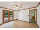 Bright living room boasts beautiful floors and glass patio doors leading to an outdoor deck at 2110 Waterloo Cir, Lawrenceville, GA 30043