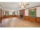 Spacious living room with fireplace, wainscoting, hardwood floors, and abundant natural light at 2110 Waterloo Cir, Lawrenceville, GA 30043