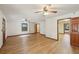 Spacious living room featuring wood floors, a ceiling fan, and a built-in bookshelf at 2110 Waterloo Cir, Lawrenceville, GA 30043