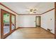 Inviting living room with beautiful floor, crown molding, and glass patio doors for outdoor access at 2110 Waterloo Cir, Lawrenceville, GA 30043