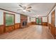 Bright living area with hardwood floors, fireplace, wainscoting, and glass patio doors at 2110 Waterloo Cir, Lawrenceville, GA 30043