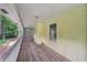 Welcoming screened porch showing ample space for outdoor seating and enjoying the surrounding landscape from inside the home at 2110 Waterloo Cir, Lawrenceville, GA 30043