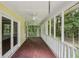 Relaxing screened porch featuring ceiling fans and lovely views of the surrounding trees and property at 2110 Waterloo Cir, Lawrenceville, GA 30043