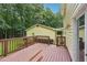 Beautiful wooden deck and lush landscape create a serene backyard setting that is perfect for relaxation and entertainment at 2110 Waterloo Cir, Lawrenceville, GA 30043