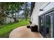 Spacious backyard featuring a patio with outdoor seating and lush green grass at 2432 Kelly Lake Dr, Decatur, GA 30032