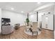 Open basement layout featuring modern flooring, TV area, sitting area, and a dining table at 2432 Kelly Lake Dr, Decatur, GA 30032