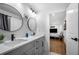 Recently remodeled bathroom featuring double sinks, modern fixtures, and stylish mirrors at 2432 Kelly Lake Dr, Decatur, GA 30032