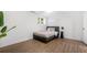 Comfortable bedroom with wood floors, neutral colors and a side table at 2432 Kelly Lake Dr, Decatur, GA 30032