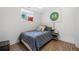 Cozy bedroom with wood floors, neutral colors and a creative wall decoration at 2432 Kelly Lake Dr, Decatur, GA 30032