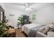 This bedroom is set up as a living space with plants, TV and wood-look flooring at 2432 Kelly Lake Dr, Decatur, GA 30032