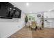 Dining area featuring contemporary furnishings and a view into a modern kitchen at 2432 Kelly Lake Dr, Decatur, GA 30032