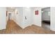 Hallway with wood floors and doors leading to bedrooms and office space at 2432 Kelly Lake Dr, Decatur, GA 30032