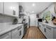 Modern kitchen featuring white cabinetry, stainless steel appliances, and stylish marble countertops at 2432 Kelly Lake Dr, Decatur, GA 30032