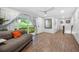 Cozy living room boasts neutral tones, wood grain floors, and a view of the outdoors at 2432 Kelly Lake Dr, Decatur, GA 30032