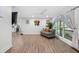 Bright living room boasts sleek wood grain floors and contemporary furnishings at 2432 Kelly Lake Dr, Decatur, GA 30032