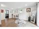 Bright office space with wood floors, a desk and a chair near the entrance to a bedroom at 2432 Kelly Lake Dr, Decatur, GA 30032