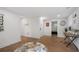 Bright office space with wood floors and a desk and a chair near the entrance to a bedroom at 2432 Kelly Lake Dr, Decatur, GA 30032