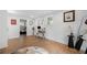 Bright office space with wood floors, a desk and a chair near the entrance to a bedroom at 2432 Kelly Lake Dr, Decatur, GA 30032