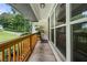 Covered front porch showcasing a tranquil outdoor seating area and shade at 2432 Kelly Lake Dr, Decatur, GA 30032