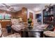 Dining area with wooden table and chairs, adjacent to kitchen with ceiling fan at 265 Forest Lake Dr, Covington, GA 30016