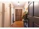 Inviting foyer with hardwood floors, a closet, and a decorative plant at 265 Forest Lake Dr, Covington, GA 30016