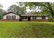 Charming one-story home with a brick foundation, neutral siding, and a well-manicured lawn at 265 Forest Lake Dr, Covington, GA 30016