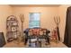 Comfortable living room featuring a black leather couch, decorative pillows, and a glass coffee table at 265 Forest Lake Dr, Covington, GA 30016