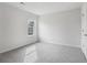 Bright, carpeted bedroom with large window and neutral walls at 386 Tallulah Ln, Grayson, GA 30017