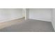 Spacious carpeted living room adjacent to a hardwood floor area, ideal for Gathering gatherings at 386 Tallulah Ln, Grayson, GA 30017