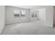 Bright, open living room with neutral tones and large windows at 386 Tallulah Ln, Grayson, GA 30017