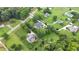 Scenic aerial view showcasing the home's placement on a large lot amongst lush greenery at 3992 Spot Rd, Cumming, GA 30040