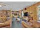Inviting basement with wood paneling, comfortable seating, and entertainment setup for relaxation at 3992 Spot Rd, Cumming, GA 30040
