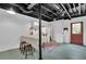 Basement with potential for customization, featuring a kitchenette, and door to the outside at 3992 Spot Rd, Cumming, GA 30040