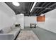 Unfinished basement offering potential for customization, complete with a foosball table and ample space at 3992 Spot Rd, Cumming, GA 30040