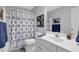 Well-maintained bathroom features a shower-tub combo and ample counter space at 3992 Spot Rd, Cumming, GA 30040