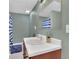 Charming bathroom with a vanity, neutral colors and a decorative mirror at 3992 Spot Rd, Cumming, GA 30040