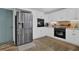 Updated kitchen boasts stainless steel appliances, white cabinets, and stylish backsplash at 3992 Spot Rd, Cumming, GA 30040