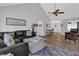 Open concept living area with hardwood flooring, vaulted ceilings and neutral decor at 3992 Spot Rd, Cumming, GA 30040