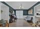 Stylish living room with dark blue walls, piano, and ample space for entertaining at 3992 Spot Rd, Cumming, GA 30040