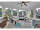 Bright sunroom with neutral color palette and lots of windows providing natural light at 3992 Spot Rd, Cumming, GA 30040