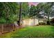 Charming home featuring a lush backyard with a wooden deck and large windows at 5114 N Ivy Ne Rd, Atlanta, GA 30342