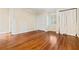 Empty bedroom with wood floors, closet, large windows, and natural light at 5114 N Ivy Ne Rd, Atlanta, GA 30342