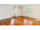 Spacious bedroom with closet, large windows, and hardwood floors at 5114 N Ivy Ne Rd, Atlanta, GA 30342
