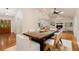 Open-concept dining area with hardwood floors, flows to the living room and kitchen, great for entertaining at 5114 N Ivy Ne Rd, Atlanta, GA 30342