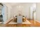 Bright dining area with modern chandelier, seating for six, and view of adjacent room at 5114 N Ivy Ne Rd, Atlanta, GA 30342