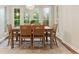 Dining room with a chandelier, natural light, and a wooden table with seating for six at 5114 N Ivy Ne Rd, Atlanta, GA 30342