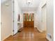 Bright foyer with hardwood floors, wooden front door, and neutral walls, creating a welcoming entrance at 5114 N Ivy Ne Rd, Atlanta, GA 30342